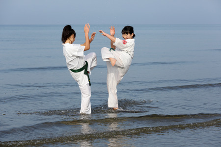 KAGAWA, JAPAN-Jan 3: Japanese karate girls training of karate in midwinter of a new year at Ichinomiya Beach, January 3, 2016, Kagawa, Japanのeditorial素材