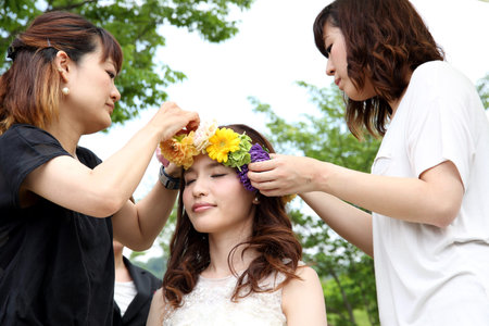 KAGAWA, JAPAN-MAY 15, 2016: Bride in a Zentuji-gogakunosato park getting ready for her wedding, Beautician makes young beautiful bride bridal make-up.のeditorial素材