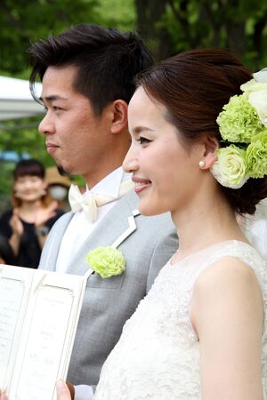 KAGAWA, JAPAN-MAY 15, 2016: Beautiful Japanese wedding couple wedding in Zentuji-Gogakunosato Park. Young wedding couple, beautiful bride with groom portrait. May 15, 2016 in Kagawa, Japan.のeditorial素材