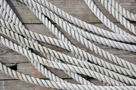 close up of old rope on wooden deckの写真素材