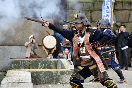 KAGAWA, JAPAN-NOVEMBER 20: Ancient firelock rifle fighters at Marugame Historical battle Festival, event dedicated to Japanese culture and tradition at Marugame-castle on November 20, 2016 in Japan.のeditorial素材