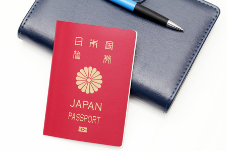 japan passport and leather notebook isolated on white backgroundの写真素材