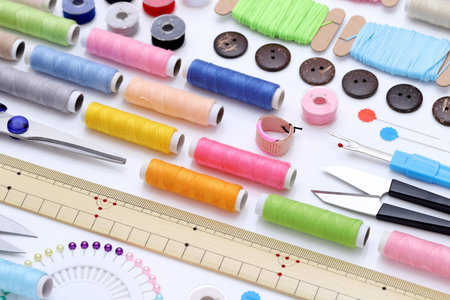 Row of sewing tools, tailoring and fashion concept-close-up on white background