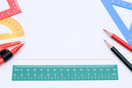 rulers, pen and notebook on white background