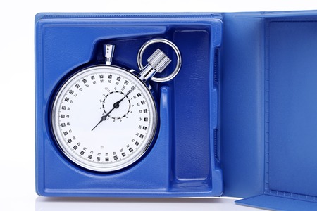 analogue metal stopwatch in a box on white backgroundの写真素材