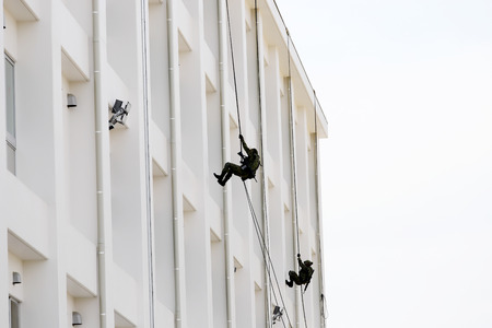 Japanese military men rappelling down the rope from building?のeditorial素材
