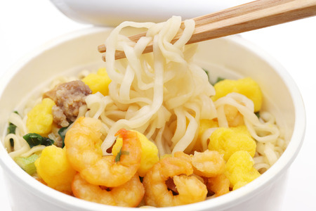 Instant noodles, noodle soup in a cup with chopsticksの写真素材