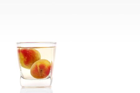 Japanese plum wine called umeshu on white backgroundの写真素材