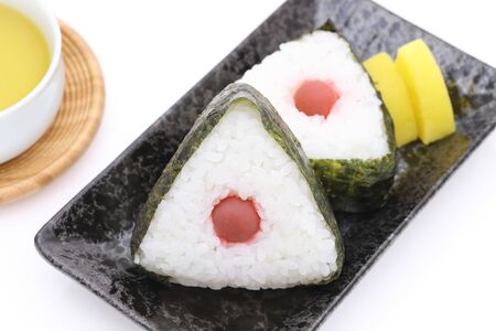 Onigiri. Rice triangle with nori and umeboshiの写真素材