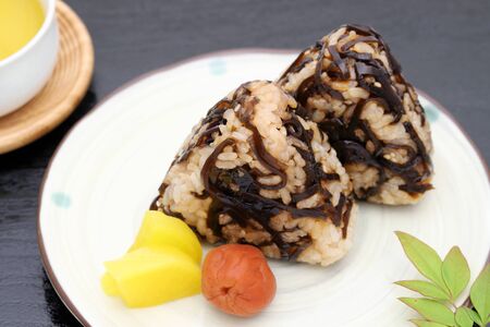 Onigiri. Rice triangle with seaweed konbuの写真素材