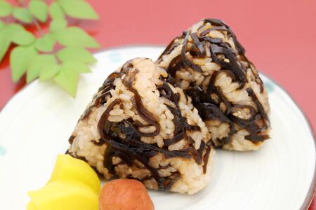 Onigiri. Rice triangle with seaweed konbuの写真素材