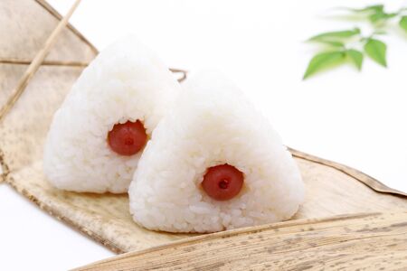 Onigiri. Rice triangle with umeboshiの写真素材