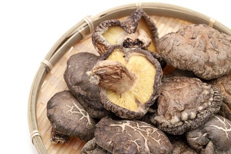 Japanese dried shiitake mushrooms in a bamboo basketの写真素材
