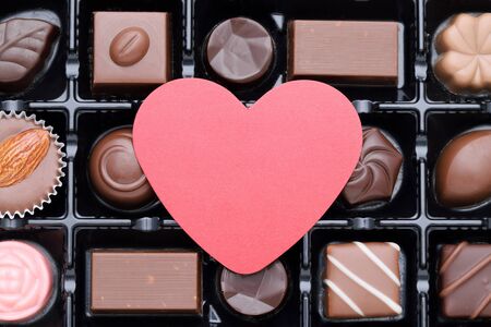 Box of assorted chocolate with heartの写真素材
