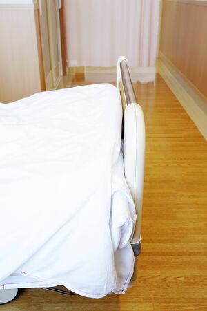 Hospital room with empty bed in a hospitalの写真素材