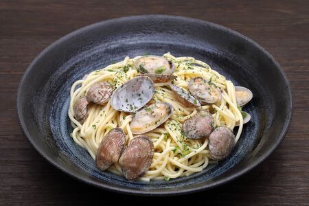 Japanese Vongole spaghetti in a dish on tableの写真素材