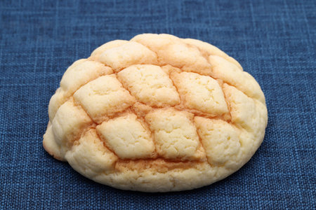 Japanese meronpan bread on dish on table