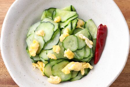 Japanese sunomono food, vinegared cucumber with baked eggの写真素材