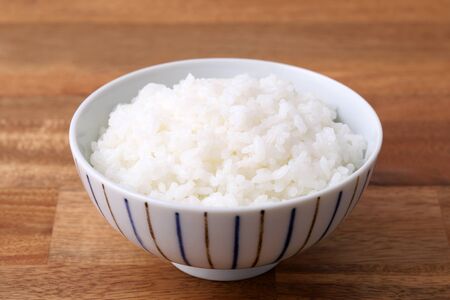 Japanese cooked white rice on table. Japanese staple foodの写真素材