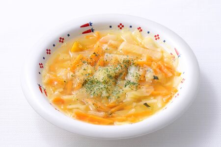 fresh vegetable soup in a dish on white backgroundの写真素材