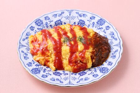 Japanese food, Omuraise with ketchup in a plate on tableの写真素材