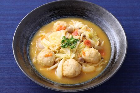 meat ball with vegetable soup in a dish on tableの写真素材
