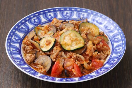 stir fry of vegetable with minced meat in a dish on tableの写真素材
