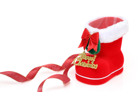 Red Santa's boot with copyspace isolated on white backgroundの写真素材
