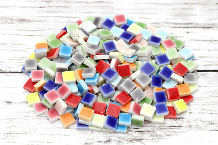 stacked of colorful tiles on white wooden tableの写真素材