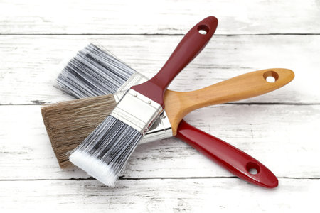 paint brush on grunge wood plank backgroundの写真素材