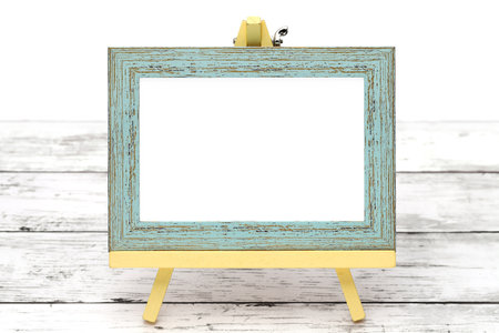 old wooden picture frame with easel on grungy white tableの写真素材
