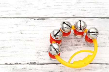 colorful jingle bell on a white wooden tableの写真素材