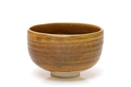 Single tea bowl used in Japanese matcha tea ceremony on white backgroundの写真素材