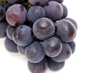 bunch of ripe purple grapes isolated on white backgroundの写真素材
