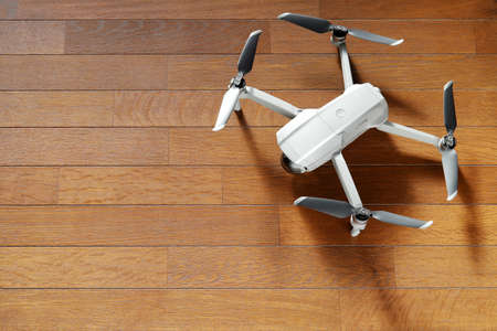 small drone copter on a wooden backgroundの写真素材