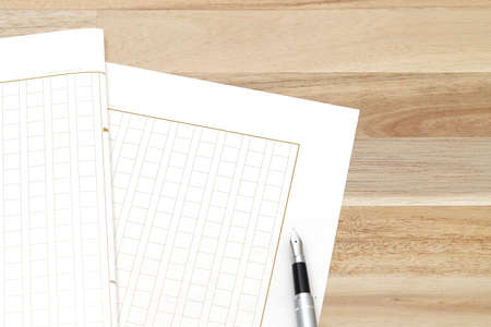 Japanese manuscript paper with fountain pen, Genko yoshi on wooden tableの写真素材