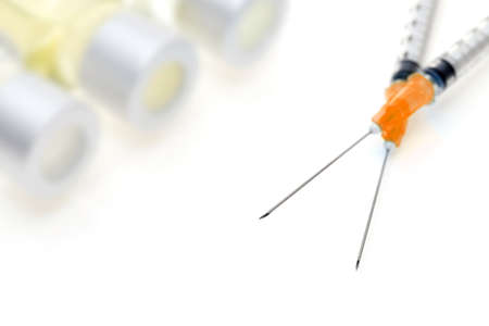 medical disposable syringe with vaccine bottle on white backgroundの写真素材