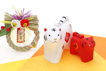 Dolls of Tora Tiger. Japanese new year card. Japanese new year tiger object. Japanese word of this photography means "fortune, congraturations"の写真素材