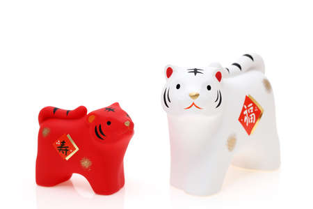 Dolls of Tora Tiger. Japanese new year card. Japanese new year tiger object. Japanese word of this photography means "fortune"の写真素材