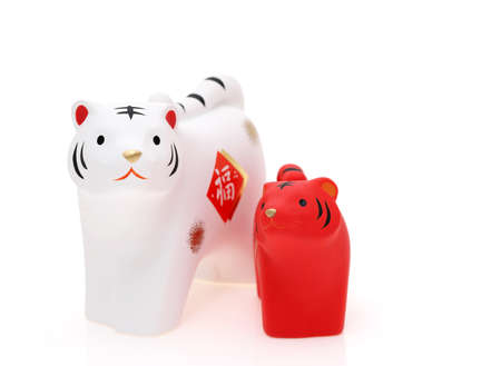 Dolls of Tora Tiger. Japanese new year card. Japanese new year tiger object. Japanese word of this photography means "fortune"の写真素材