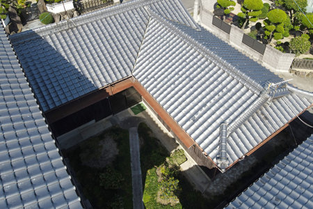 Japanese house roof building architecture exterior photography from drone, Inspecting home roofing.の写真素材