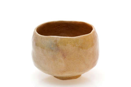Single tea bowl used in Japanese matcha tea ceremony on white backgroundの写真素材