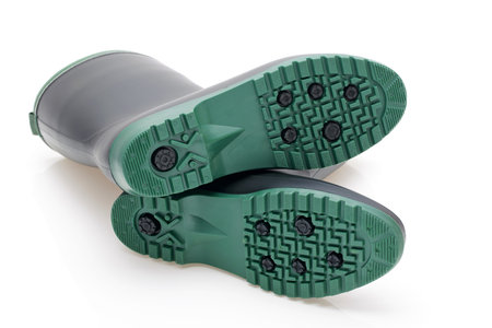 Pair of black waterproof rubber boots isolated on a white backgroundの写真素材