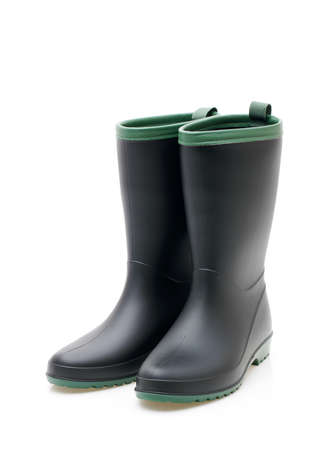 Pair of black waterproof rubber boots isolated on a white backgroundの写真素材
