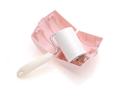 close up of sticky roller cleaning, housework and housekeeping conceptの写真素材