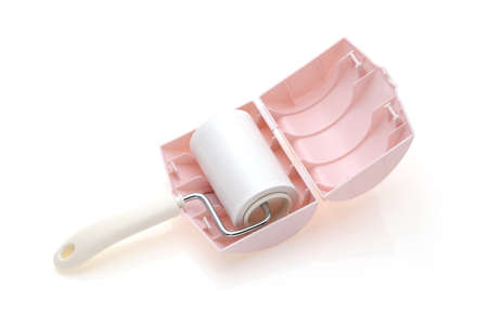 close up of sticky roller cleaning, housework and housekeeping conceptの写真素材