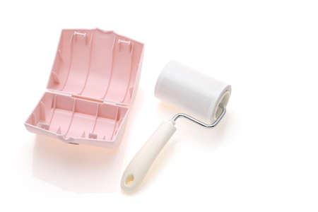 close up of sticky roller cleaning, housework and housekeeping conceptの写真素材