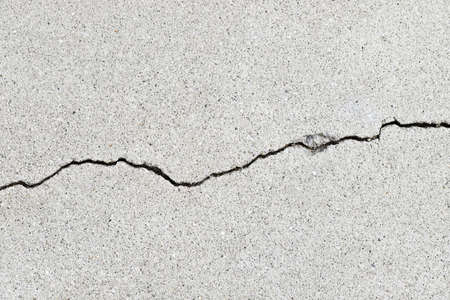 Gray cracked building wall texture for background, copy spaceの写真素材