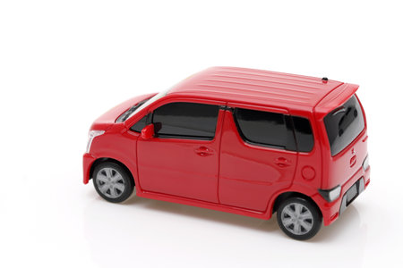 small toy car with red colors isolated on white backgroundの写真素材