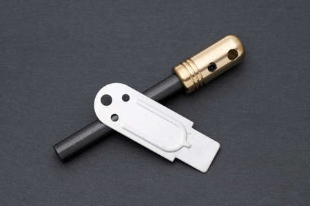Fire starter, camping equipment on dark grey backgroundの写真素材